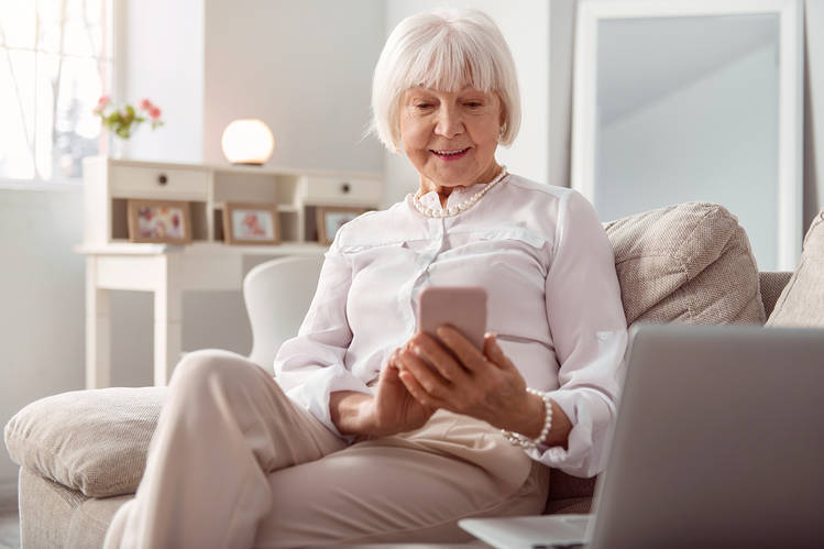 Elderly woman using phone